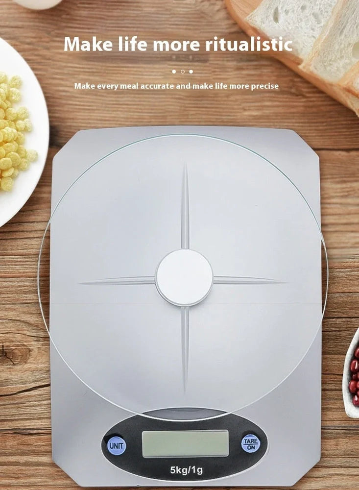 Silver white mini electronic kitchen scale with digital display showing 0.1g precision measurements