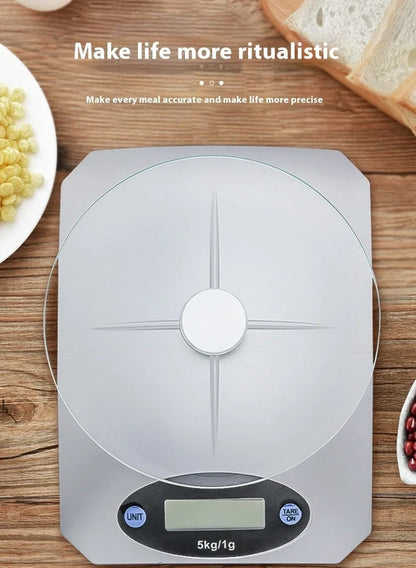 Silver white mini electronic kitchen scale with digital display showing 0.1g precision measurements