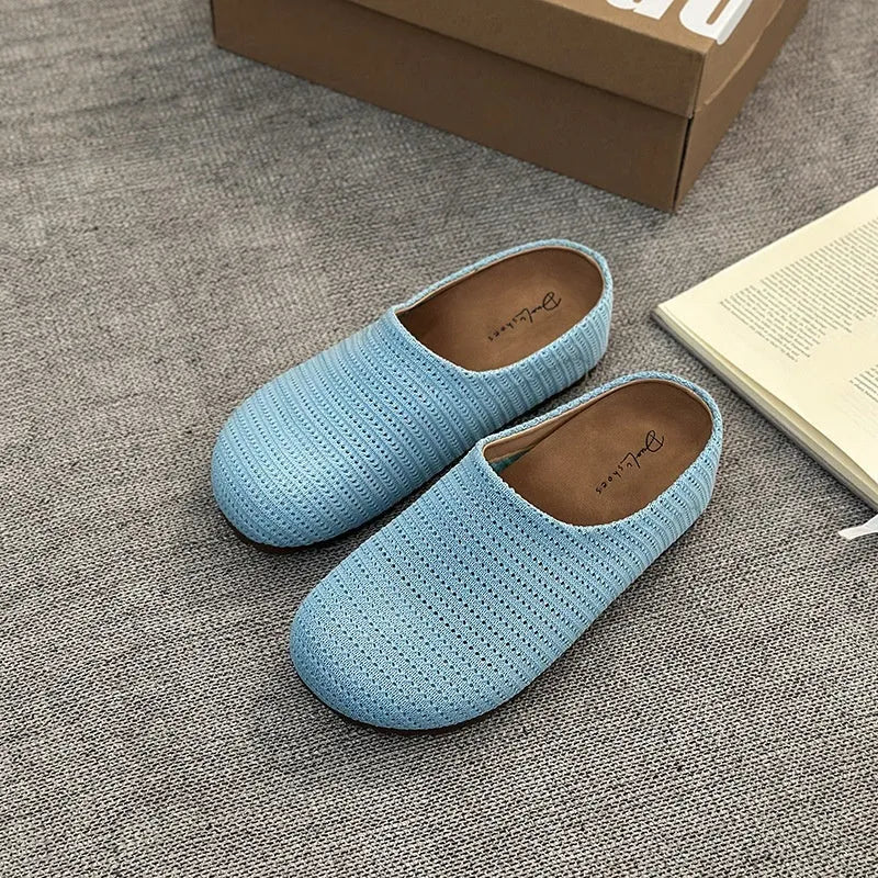 Women's non-slip cloth slippers with rubber sole in beige colour showing round toe design