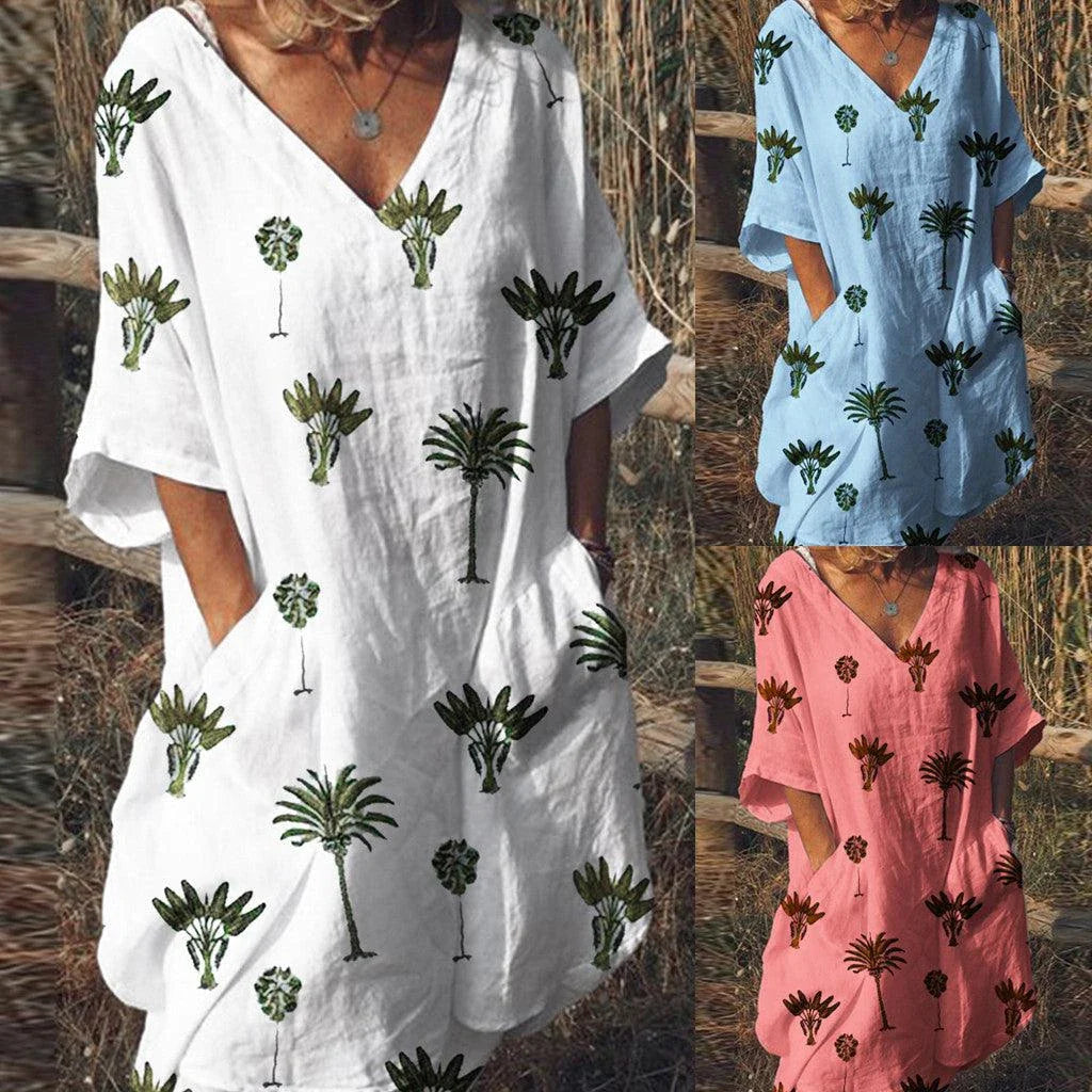 Leaf print v-neck casual flared dress in blue with a flared skirt and short sleeves