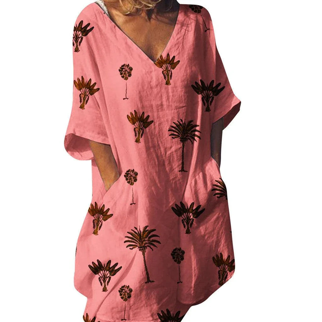 Leaf print v-neck casual flared dress in blue with a flared skirt and short sleeves