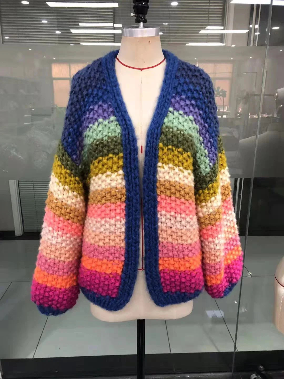 Handmade rainbow striped contrast color thick needle sweater coat in a vibrant, oversized design
