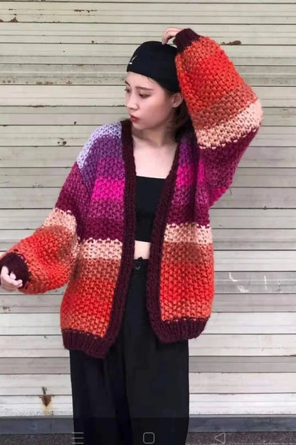 Handmade rainbow striped contrast color thick needle sweater coat in a vibrant, oversized design