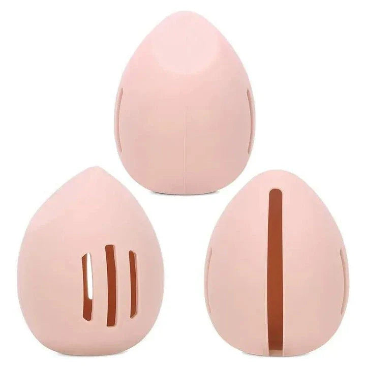Compact silicone makeup sponge holder in pink color, designed to keep beauty blenders clean and organized