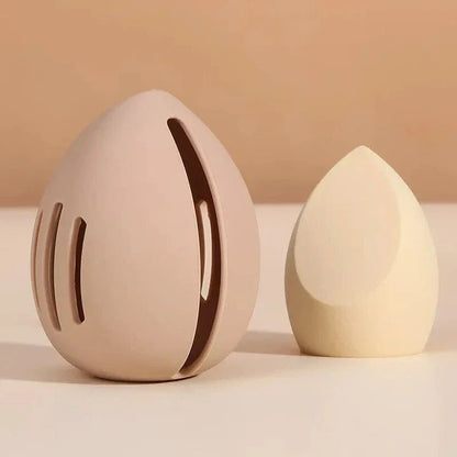 Compact silicone makeup sponge holder in pink color, designed to keep beauty blenders clean and organized