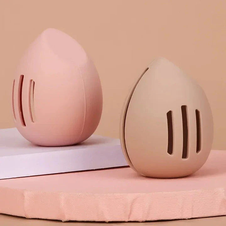 Compact silicone makeup sponge holder in pink color, designed to keep beauty blenders clean and organized
