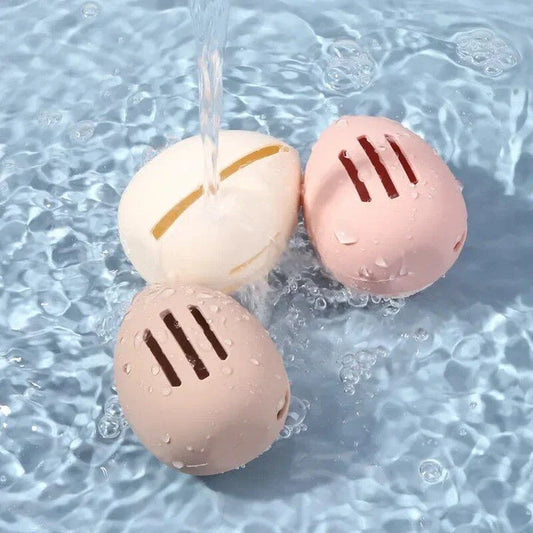 Compact silicone makeup sponge holder in pink color, designed to keep beauty blenders clean and organized