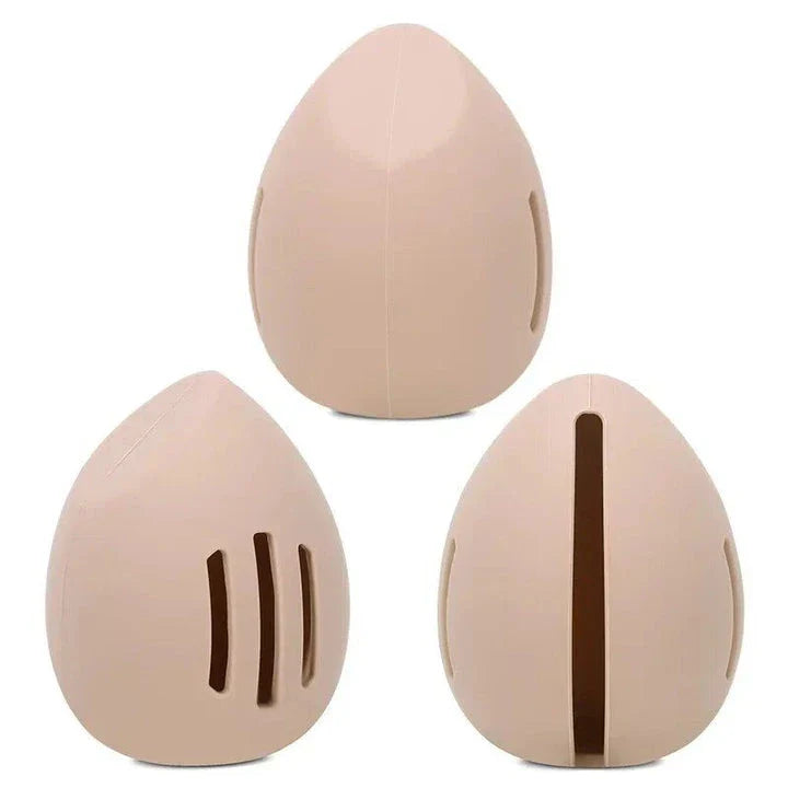 Compact silicone makeup sponge holder in pink color, designed to keep beauty blenders clean and organized