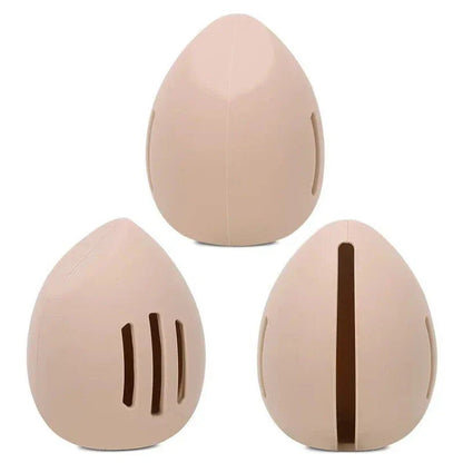 Compact silicone makeup sponge holder in pink color, designed to keep beauty blenders clean and organized