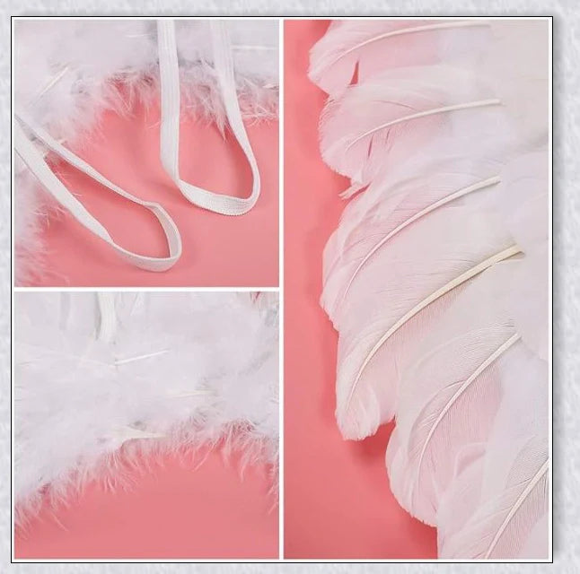 Pair of large, feathered wings in black and white colors, perfect for Halloween costumes and fantasy-themed events.