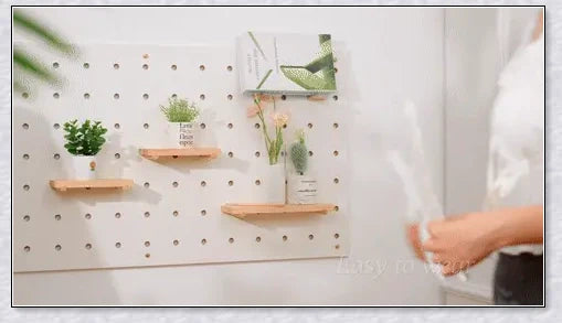 Pair of large, feathered wings in black and white colors, perfect for Halloween costumes and fantasy-themed events.