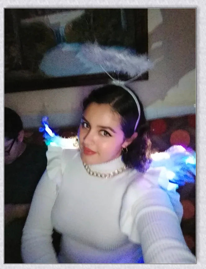 Pair of large, feathered wings in black and white colors, perfect for Halloween costumes and fantasy-themed events.