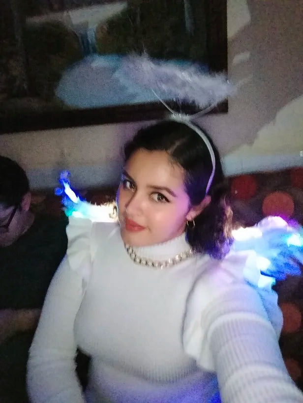 Pair of large, feathered wings in black and white colors, perfect for Halloween costumes and fantasy-themed events.