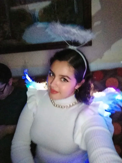 Pair of large, feathered wings in black and white colors, perfect for Halloween costumes and fantasy-themed events.