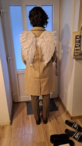 Pair of large, feathered wings in black and white colors, perfect for Halloween costumes and fantasy-themed events.