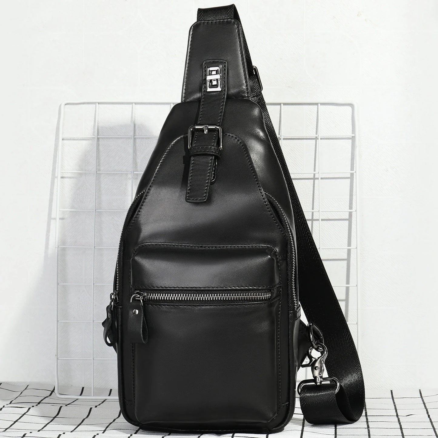 Men's leather chest bag crossbody in a sleek, vertical square design with multiple interior pockets for organized storage
