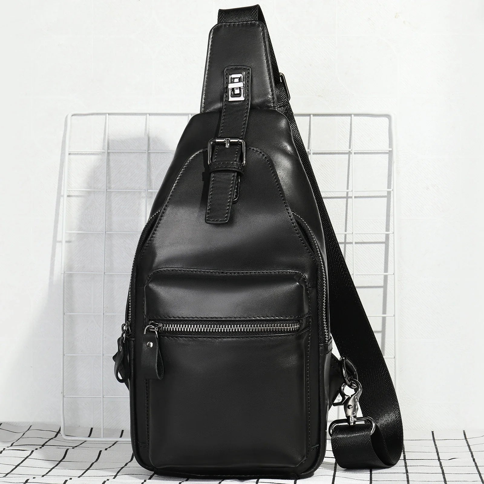 Men's leather chest bag crossbody in a sleek, vertical square design with multiple interior pockets for organized storage