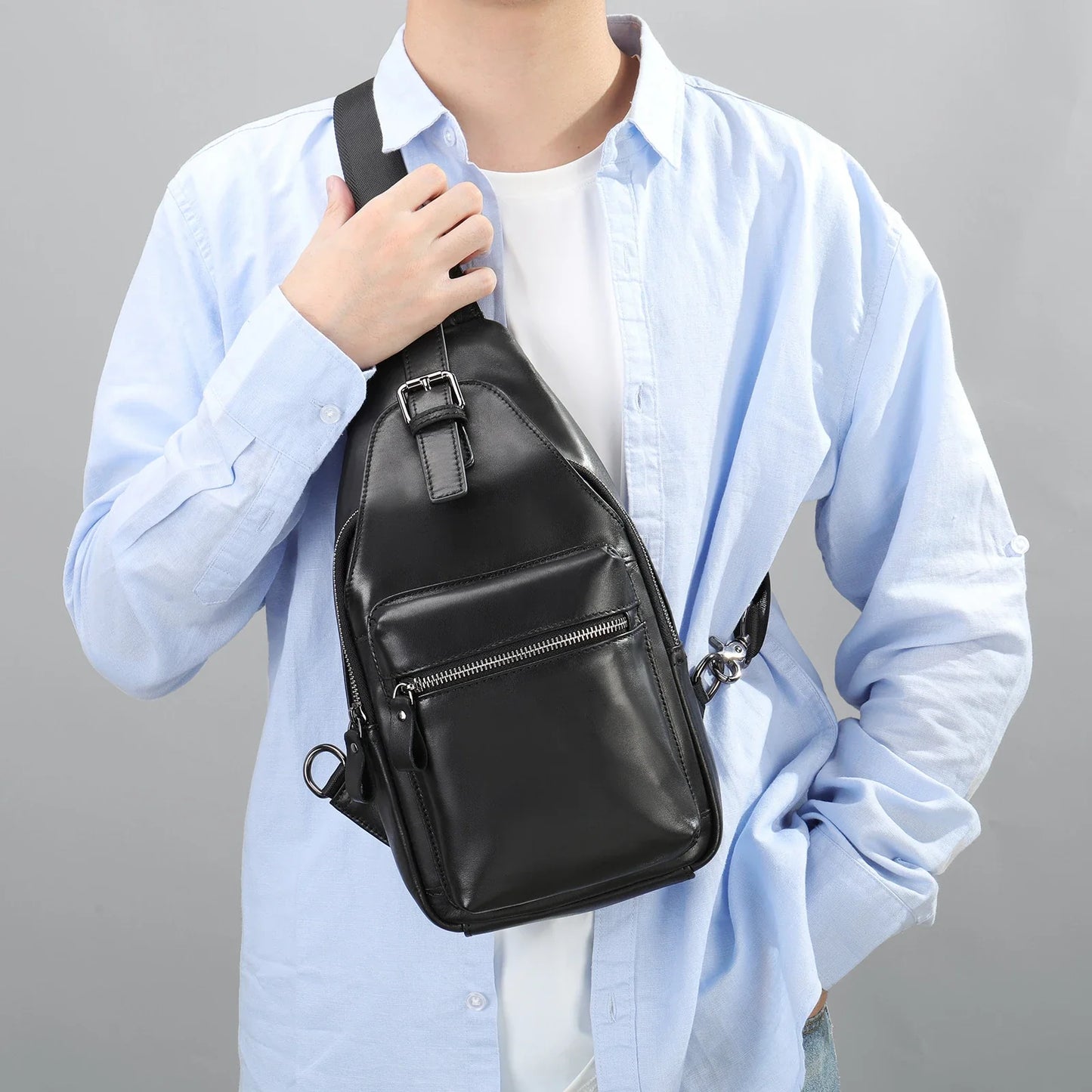Men's leather chest bag crossbody in a sleek, vertical square design with multiple interior pockets for organized storage