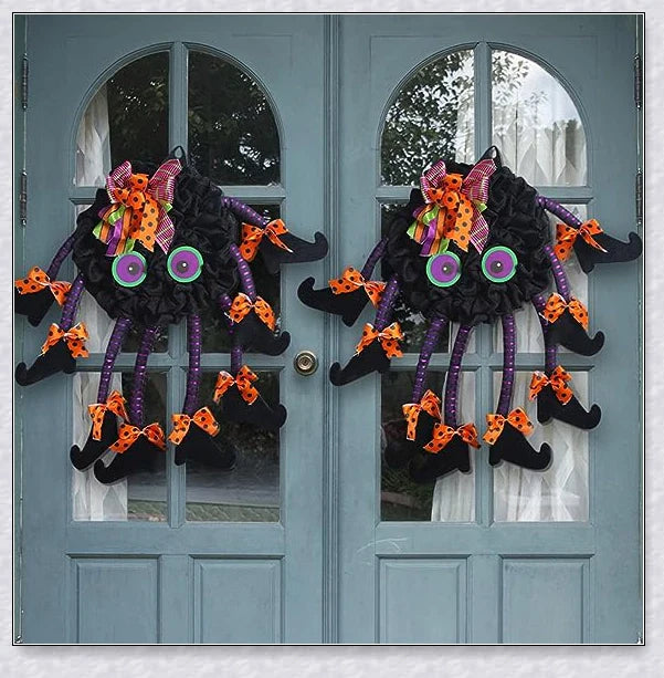 Spiri Halloween Multi-Legged Witch Wreath with orange, purple, and black colors, witch legs, striped boots, and Halloween ribbons