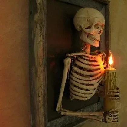Life-size 3D haunted house skull Halloween decoration with pillar candles for a spooky, mystical ambiance