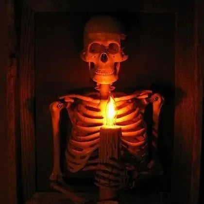 Life-size 3D haunted house skull Halloween decoration with pillar candles for a spooky, mystical ambiance