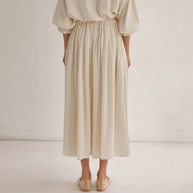 Elegant two-piece set with lantern sleeve shirt and chic skirt, featuring Korean and Japanese fashion influences.