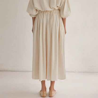 Elegant two-piece set with lantern sleeve shirt and chic skirt, featuring Korean and Japanese fashion influences.