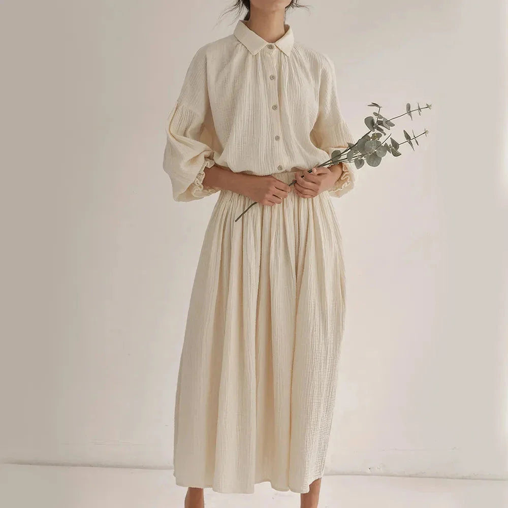Elegant two-piece set with lantern sleeve shirt and chic skirt, featuring Korean and Japanese fashion influences.