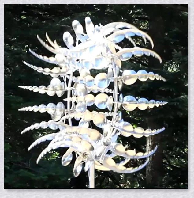 Mesmerizing metal kinetic sculpture with eighteen balanced blades rotating in opposite directions, creating a hypnotic visual display for your outdoor space