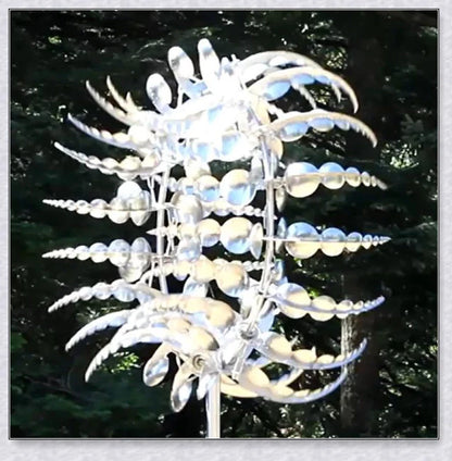 Mesmerizing metal kinetic sculpture with eighteen balanced blades rotating in opposite directions, creating a hypnotic visual display for your outdoor space