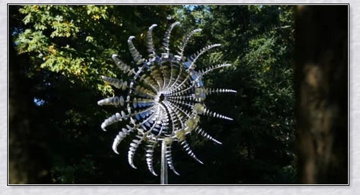 Mesmerizing metal kinetic sculpture with eighteen balanced blades rotating in opposite directions, creating a hypnotic visual display for your outdoor space