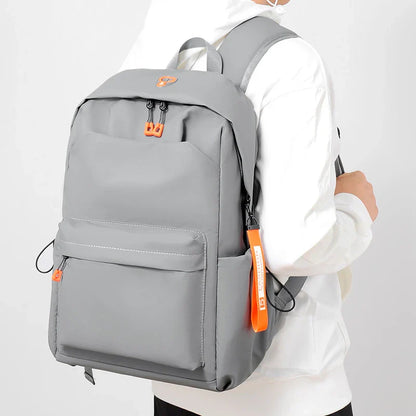 Men's simple casual travel laptop bag in grey color, featuring adjustable shoulder straps and a durable polyester lining