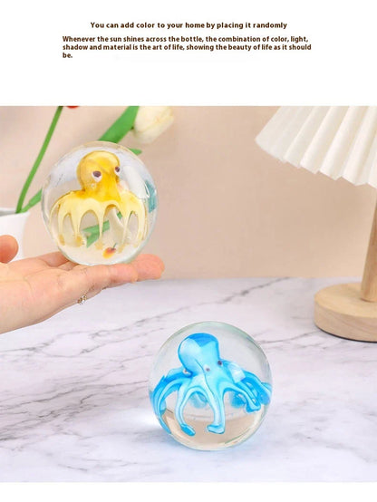 Handcrafted glass octopus decoration for car windshield, featuring vibrant colors and intricate design