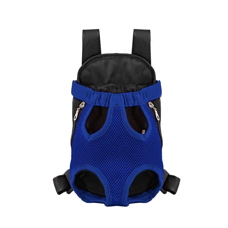 A small dog in a front-worn nylon carrier backpack with mesh panels, adjustable straps and side zips.
