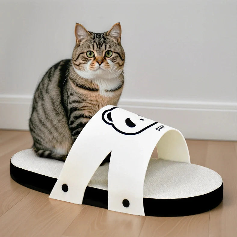 White slipper style cat scratch board made from corrugated paper measuring 30cm length