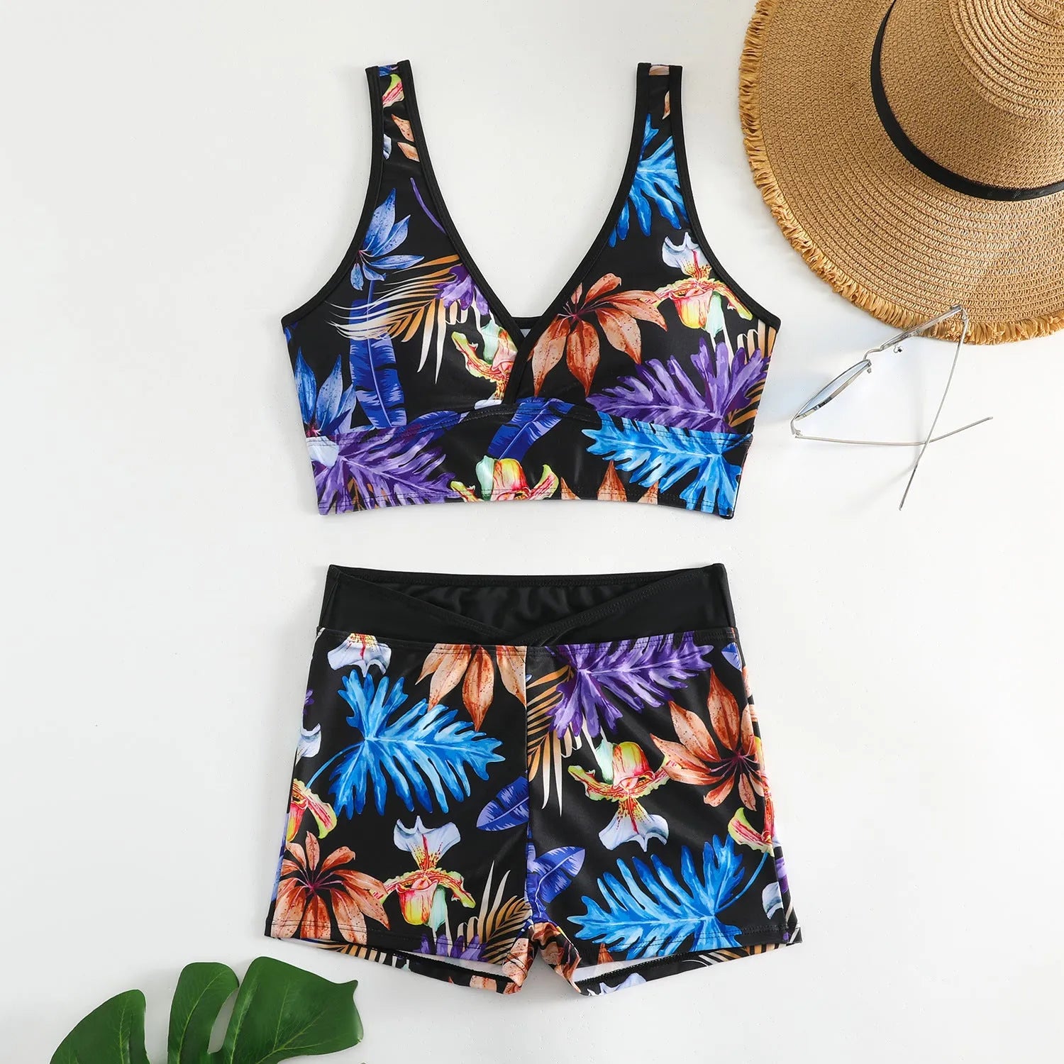 Women's two-piece printed swimsuit set with boxer-style briefs and sleeveless top in multi-colour pattern