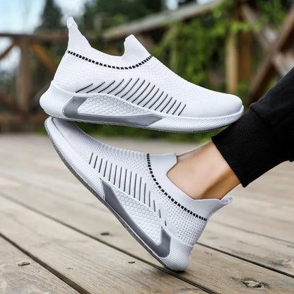 Men's black and white striped mesh slip-on sneakers with lace-up front.