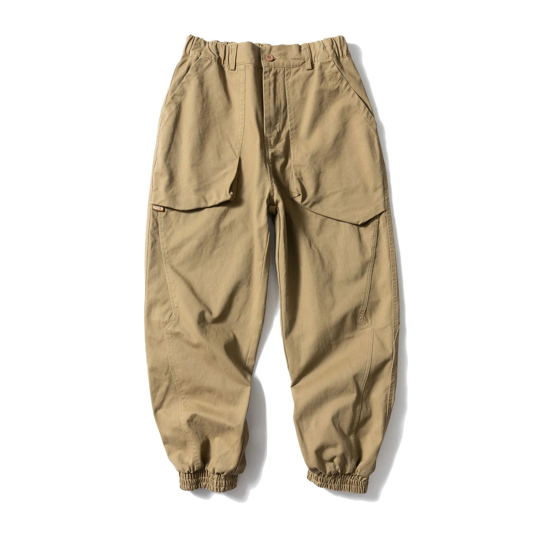 Black cotton casual pants with large pockets, tapered legs, and ankle ties on a hanger.