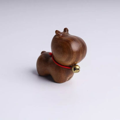 Handmade green sandalwood kitten ornament with unique design