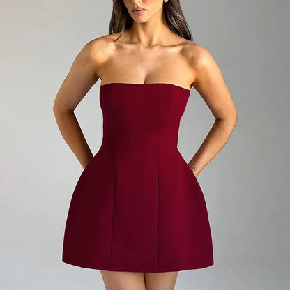 Backless women's tube dress in solid colour with high waist and A-line short skirt.