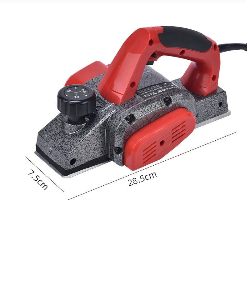 Red desktop electric wood planer with aluminium shell showing 82mm planing width
