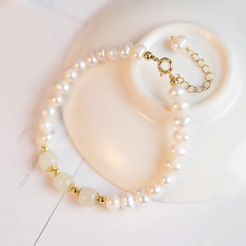 Natural freshwater pearl bracelet with diamond-shaped beads in a Korean style, shown in deep Hetian jade colour.