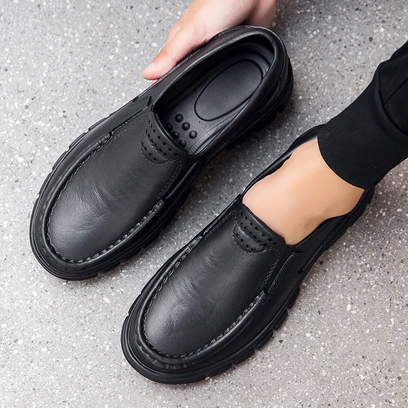 Men's black and brown slip-on work shoes with a mid-top, platform heel, and round toe.