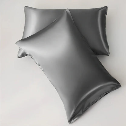 Silk-effect satin envelope pillowcase in navy blue showing envelope closure and smooth fabric texture