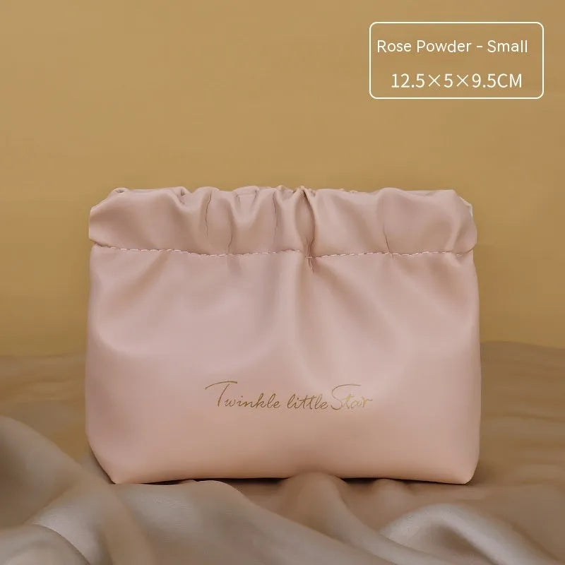 Leather travel toiletry bag with dry-wet separation compartments in caramel mocha colour with letter detailing