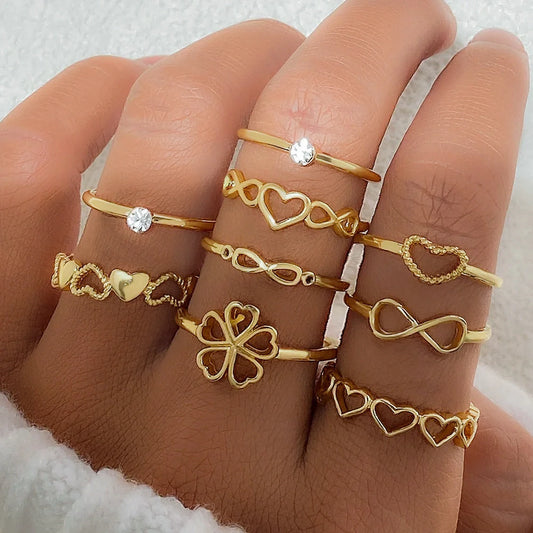 Gold color heart rings set with vintage designs, including geometric and butterfly motifs