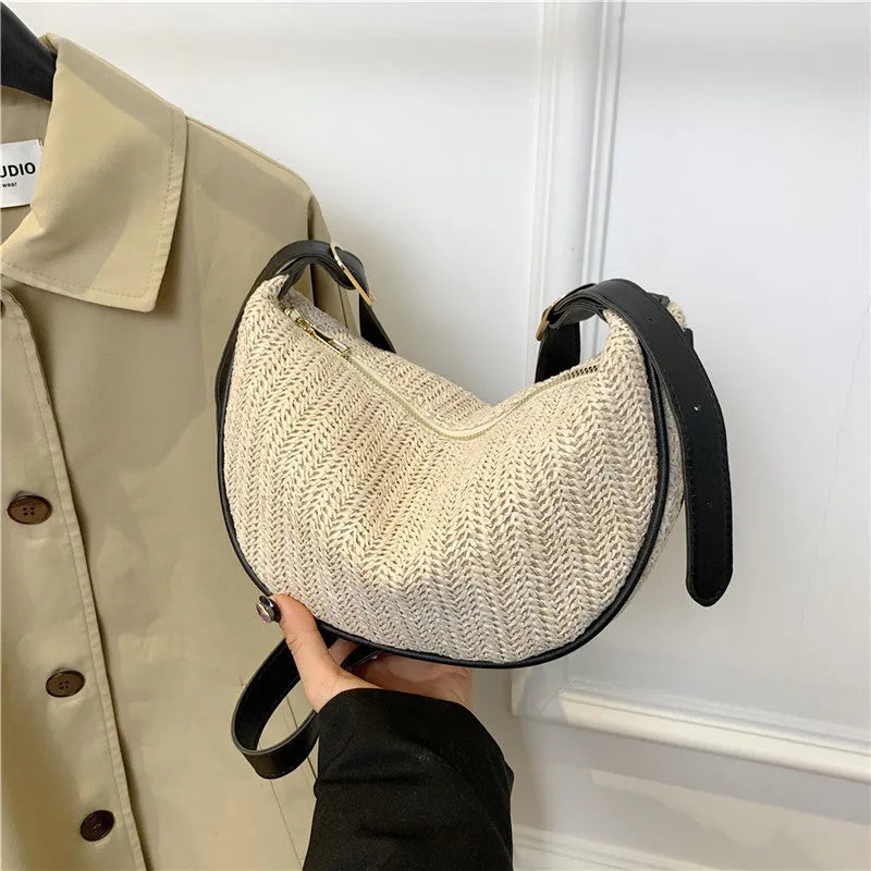 Women's woven straw crossbody bag with internal phone and file pockets in various colours.