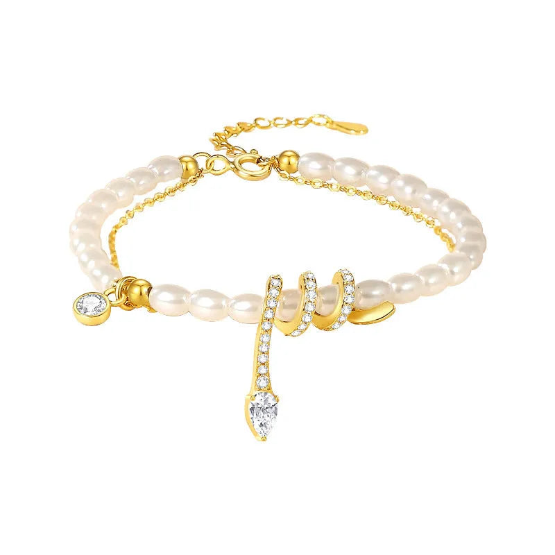 Pearl snake bracelet in 925 silver with electroplated gold or white gold finish and geometric animal design