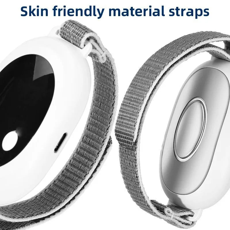 White handheld sleep aid remote control device with USB charging port on a bedside table.