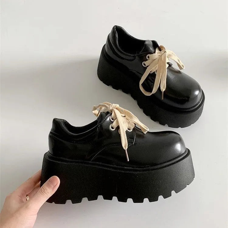Women's black matte lace-up shoes with 6-8cm English muffin heel and round toe, shown on a neutral background